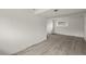 Bright basement with wood-look floors and neutral walls showcasing a clean, adaptable space at 16325 E Alabama Dr, Aurora, CO 80017
