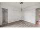 Bright bedroom with light wood-look floors and neutral walls showcasing a clean, adaptable space at 16325 E Alabama Dr, Aurora, CO 80017