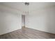 Blank canvas bedroom with wood-look floors, offering a versatile space for personalization and comfort at 16325 E Alabama Dr, Aurora, CO 80017