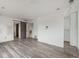 Bedroom with wood-look floors, with a barn door leading to another room at 16325 E Alabama Dr, Aurora, CO 80017