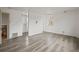 Bright bedroom featuring stylish wood-look floors and fresh white walls ready for personalization at 16325 E Alabama Dr, Aurora, CO 80017