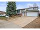 Charming two-story home featuring a well-maintained front yard, brick accents, and an attached two-car garage at 16325 E Alabama Dr, Aurora, CO 80017