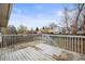 Wood deck overlooking fenced backyard at 16325 E Alabama Dr, Aurora, CO 80017