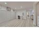 Spacious basement area featuring gray wood-look floors, recessed lighting, and desk, perfect for crafting and home office at 3367 Dove Valley Pl, Castle Rock, CO 80108