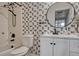 Bathroom featuring tub shower combination, modern faucet, and decorative mirror at 3367 Dove Valley Pl, Castle Rock, CO 80108