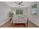 Cozy bedroom featuring hardwood floors, natural light, and neutral paint at 3367 Dove Valley Pl, Castle Rock, CO 80108