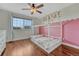 Bedroom featuring a custom bed frame, hardwood floors and natural light at 3367 Dove Valley Pl, Castle Rock, CO 80108