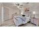 Relaxing bedroom with a ceiling fan, comfortable bed, and plenty of natural light at 3367 Dove Valley Pl, Castle Rock, CO 80108