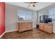 Neutral bedroom with two windows, and hardwood flooring at 3367 Dove Valley Pl, Castle Rock, CO 80108