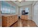 Bedroom with two windows, hardwood flooring, and closet at 3367 Dove Valley Pl, Castle Rock, CO 80108