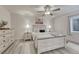 Comfortable bedroom with neutral tones, ceiling fan, and natural light at 3367 Dove Valley Pl, Castle Rock, CO 80108