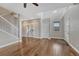Open floor plan with hardwood floors, staircase, and plenty of natural light at 3367 Dove Valley Pl, Castle Rock, CO 80108