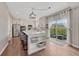 Bright, spacious kitchen with a large island, modern appliances, and sliding door that fills the room with light at 3367 Dove Valley Pl, Castle Rock, CO 80108