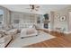 Inviting living room features a fireplace, hardwood floors, and neutral paint at 3367 Dove Valley Pl, Castle Rock, CO 80108