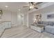 Bright living area with a gray sectional sofa, built-in shelving, and neutral decor at 3367 Dove Valley Pl, Castle Rock, CO 80108