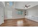 Open living room with vaulted ceiling, hardwood floors, and natural light at 3367 Dove Valley Pl, Castle Rock, CO 80108