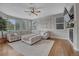 Spacious living room with hardwood floors, natural light, and a fireplace at 3367 Dove Valley Pl, Castle Rock, CO 80108