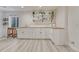 Bright room with stylish cabinets, countertops, and open shelving at 3367 Dove Valley Pl, Castle Rock, CO 80108