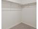 Spacious walk-in closet with double hanging rods and carpeted flooring at 6530 13Th St, Frederick, CO 80530