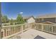 An outdoor deck showcases the neighboring houses and a blue sky, providing a relaxing outdoor space at 6612 S Muscadine Ct, Aurora, CO 80016