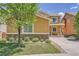 Charming exterior featuring a manicured lawn and stone accents at 6612 S Muscadine Ct, Aurora, CO 80016