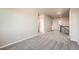 A spacious upstairs landing features a carpeted floor and neutral walls, connecting various rooms and areas at 6612 S Muscadine Ct, Aurora, CO 80016