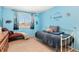 Comfortable bedroom with blue walls, two beds, and nature-themed decorations and decals at 19823 E 58Th Ave, Aurora, CO 80019