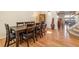 Formal dining room with hardwood floors, seating for eight, and staircase at 19823 E 58Th Ave, Aurora, CO 80019