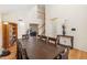 Bright dining room with hardwood floors, vaulted ceiling, and staircase to upstairs at 19823 E 58Th Ave, Aurora, CO 80019