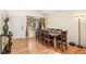 Formal dining room with hardwood floors, seating for eight, and natural light at 19823 E 58Th Ave, Aurora, CO 80019