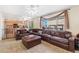Spacious living room with comfortable sectional couch and large windows at 19823 E 58Th Ave, Aurora, CO 80019