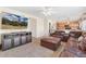 Living room with TV and comfortable couch at 19823 E 58Th Ave, Aurora, CO 80019