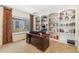 Bright office with desk and built-in bookshelves at 19823 E 58Th Ave, Aurora, CO 80019
