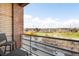 Serene balcony view overlooking a green landscape and city skyline, perfect for relaxation and enjoying the outdoors at 1610 Little Raven St # 502, Denver, CO 80202