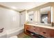 Modern bathroom featuring a double sink vanity, a bathtub and contemporary fixtures for a spa-like experience at 1610 Little Raven St # 502, Denver, CO 80202