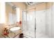 Bright bathroom features a glass vessel sink, marble walk-in shower and modern fixtures at 1610 Little Raven St # 502, Denver, CO 80202