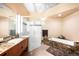 Bathroom featuring a standalone tub and a walk-in shower with glass door at 1610 Little Raven St # 502, Denver, CO 80202