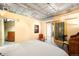 Bedroom featuring concrete ceilings, modern decor, sliding barn door and comfortable bed at 1610 Little Raven St # 502, Denver, CO 80202