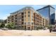 A contemporary mid-rise building with a brick facade and large windows, offering urban living at its finest at 1610 Little Raven St # 502, Denver, CO 80202