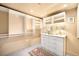 Walk-in closet featuring multiple built-in shelves, dresser, and plush rug at 1610 Little Raven St # 502, Denver, CO 80202