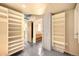 Open closet space featuring multiple shelves and an entrance to bathroom at 1610 Little Raven St # 502, Denver, CO 80202
