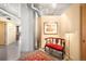 Hallway featuring neutral paint, artwork, and a stylish red cushioned bench with decor at 1610 Little Raven St # 502, Denver, CO 80202