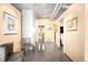 Hallway featuring neutral walls, modern fixtures, and glimpses into the rest of the home at 1610 Little Raven St # 502, Denver, CO 80202