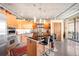 Well-lit modern kitchen boasts stainless steel appliances, bar stool seating and sleek cabinets at 1610 Little Raven St # 502, Denver, CO 80202