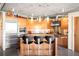 Contemporary kitchen featuring stainless steel appliances, concrete ceiling and bar stool seating at 1610 Little Raven St # 502, Denver, CO 80202