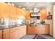Modern kitchen featuring sleek cabinets, stainless steel appliances, and concrete ceiling at 1610 Little Raven St # 502, Denver, CO 80202