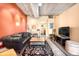 Stylish living room with a comfortable sofa, decorative rug, and vibrant wall decor, creating a welcoming atmosphere at 1610 Little Raven St # 502, Denver, CO 80202