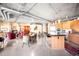 Open-concept living space with modern kitchen, fireplace, and comfortable seating area at 1610 Little Raven St # 502, Denver, CO 80202