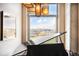 Bright living room with a view, featuring a grand piano and ample natural light streaming through the large window at 1610 Little Raven St # 502, Denver, CO 80202