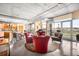 Comfortable seating area, open to kitchen, concrete ceiling, city views and modern decor at 1610 Little Raven St # 502, Denver, CO 80202